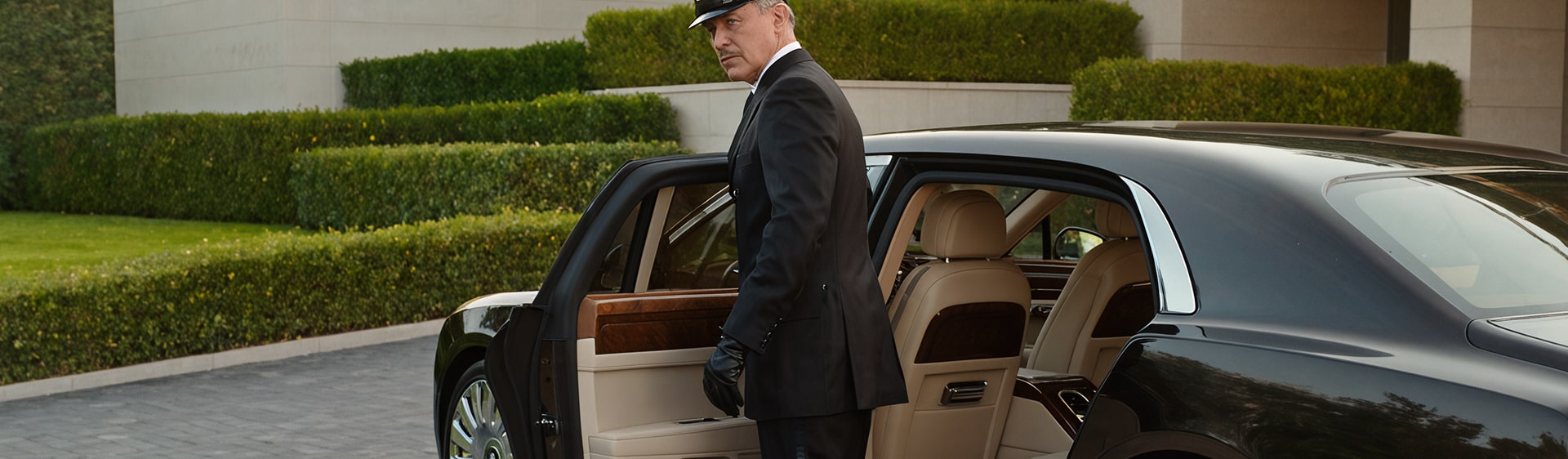 Chauffeur opening a car door