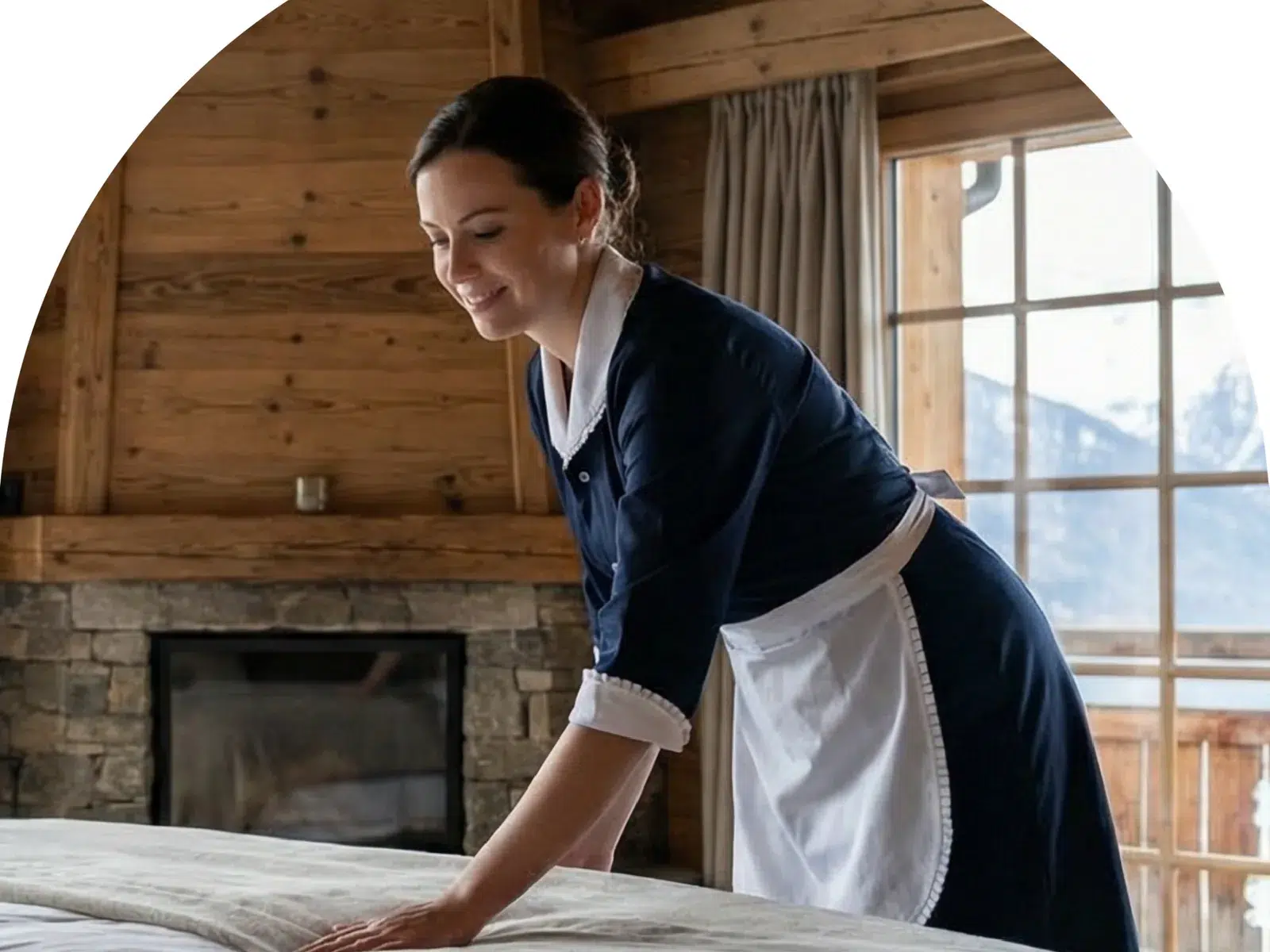 A housekeeper changing bed sheets