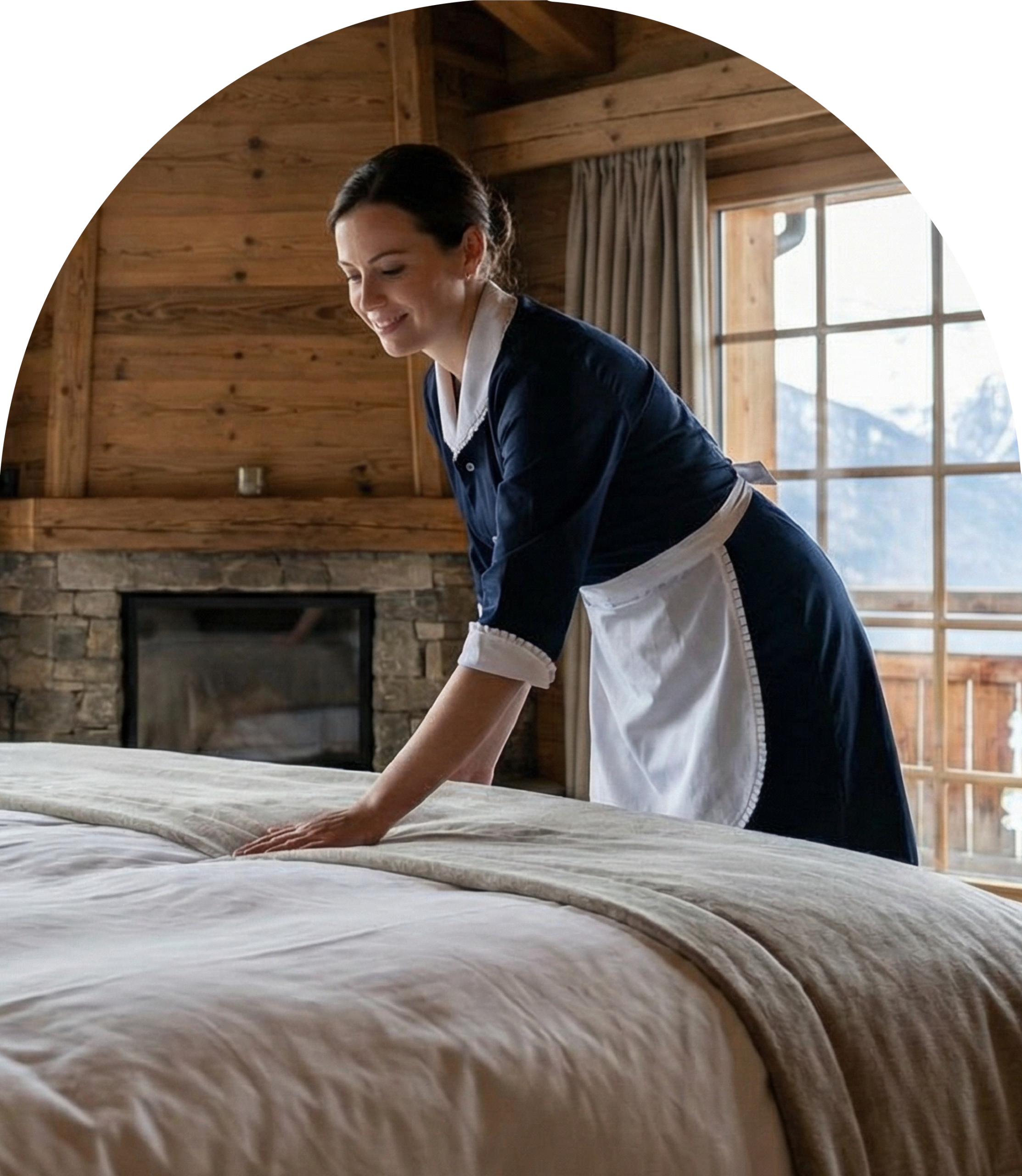 A housekeeper changing bed sheets
